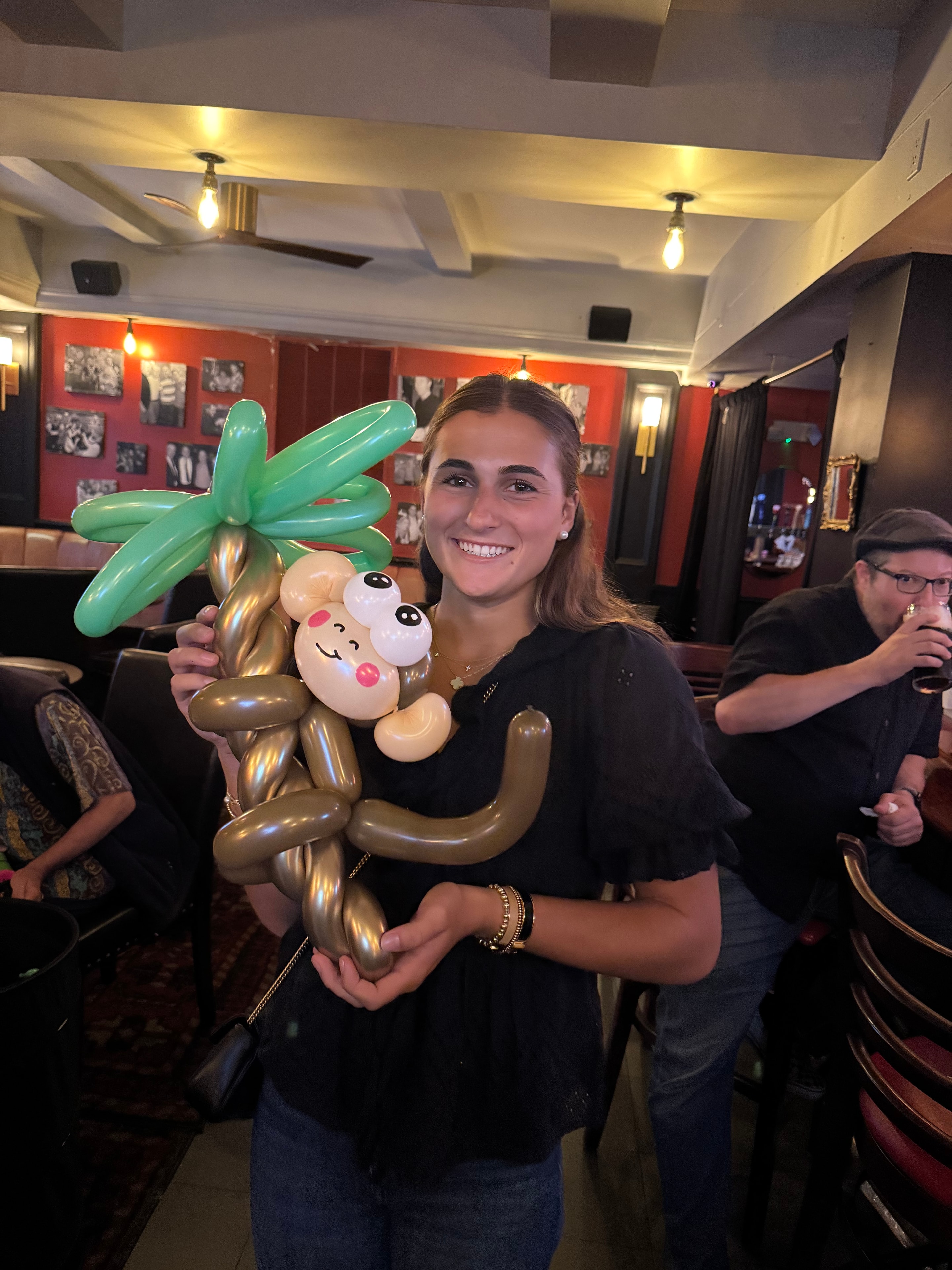 NYC balloon artist Zollipop creating custom balloon art at an event